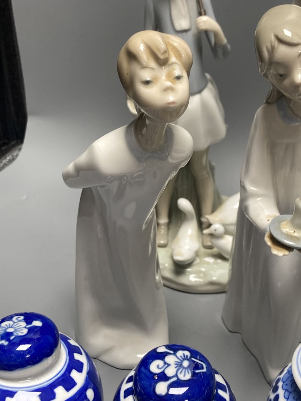 A collection of Lladro and Goebel porcelain figures and other items